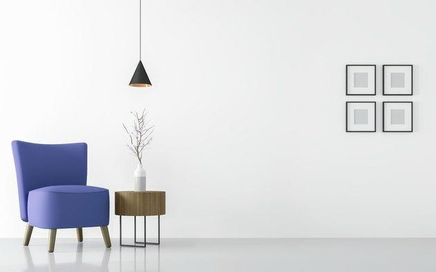 Модерен бял интериор на всекидневната със синьо кресло в 3d визуализация