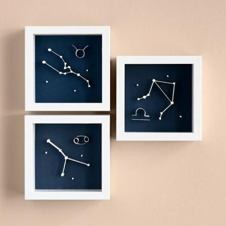 Trys įrėminti „Tamsoje švytintys“ zodiako menai