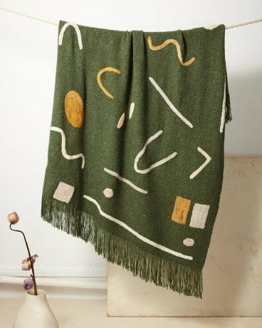decoração de casa sustentável com manta estampada verde