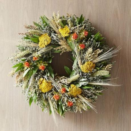 arranjo de flores de outono laranja grinalda amarela e verde