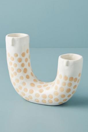 vaso em forma de u com detalhes de um rosto