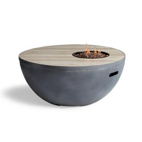 Mesa de fogo e mesa de centro em uma com detalhes circulares e base de aço